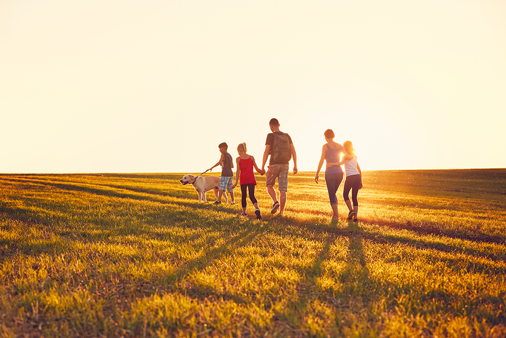 Family walking with dog